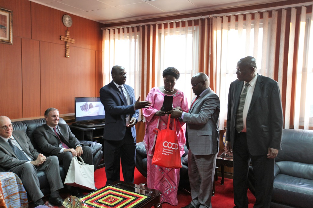 General Secretary CPA-Ivan Asiimwe (second from the left) hands over gifts from the Cooperators to the Speaker of Parliament Rt. Hon Rebecca Kadaga. Image